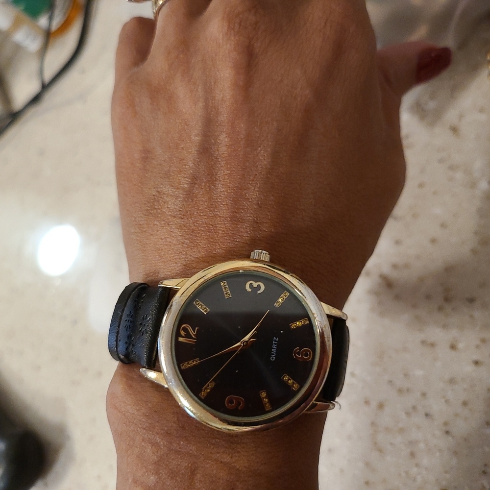 Black Singapore MOVT women's watch.